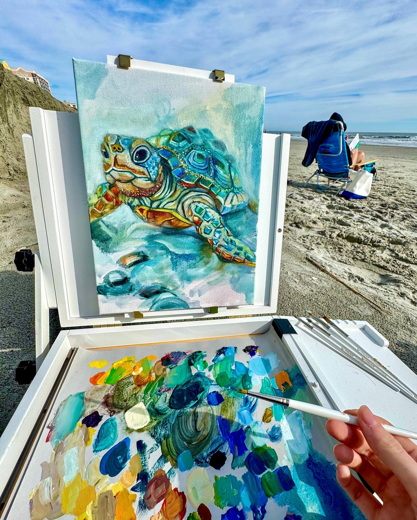 Kristen painting a sea turtle at Carolina Beach, NC